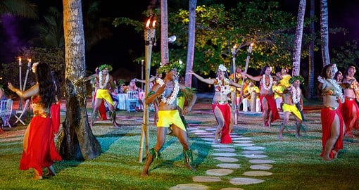 Traditional fire dancers on the resort's beach