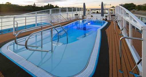 Enjoy at pool with swim-up bar on your cruise trip