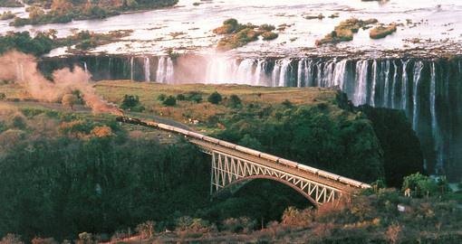 Witness the astonishing view as you pass over the stunning Victoria Falls