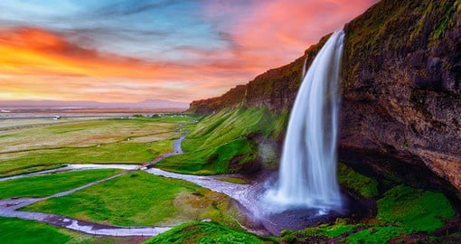 Hike up hills to admire the Seljalandfoss waterfall at its best profile