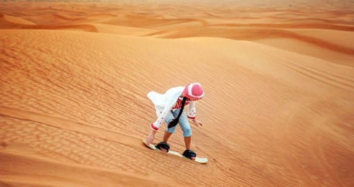 Try sandboarding on your Dubai Desert Safari