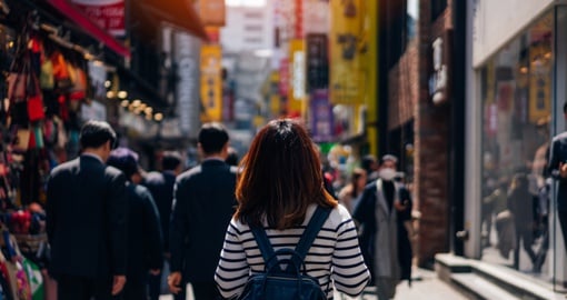 Woman walking through Seoul