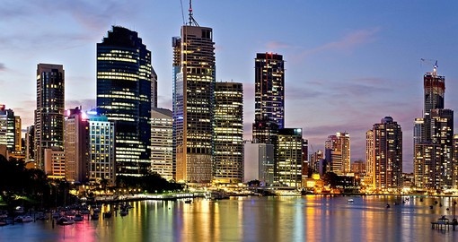 The city skyline reflected on the Brisbane River at sunset