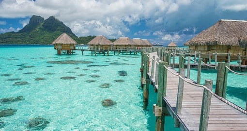 Fall asleep to the soothing sounds of lapping water while staying in an overwater bungalow