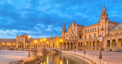 Go for a relaxing stroll along the canal that runs beside the Plaza de Espana, Seville