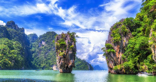 Phang Nga Bay's sheer limestone karsts  jut vertically out of the emerald-green water