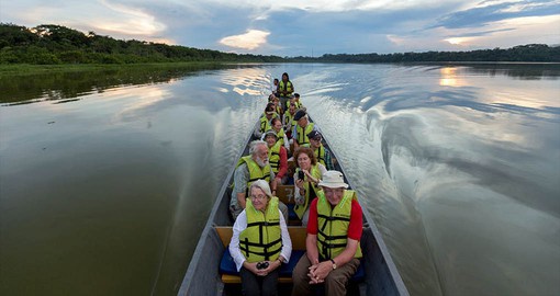 Experience tranquility and scenic views during your river boat expedition