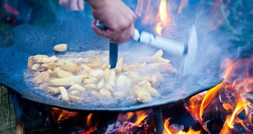 Preparing potatoes on the barbecue