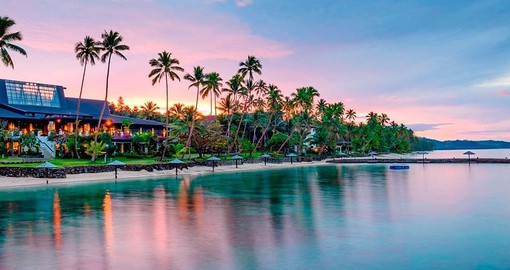 Relax with the soothing sunsets along the colourful Coral Coast