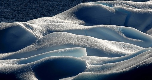 Marvel in the beauty of the ice structures and the shine that radiates off of them on your Trips to Antarctica