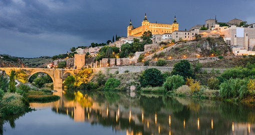 Panorama of the Alcazar above the medieval San Martin bridge - Toledo, Spain