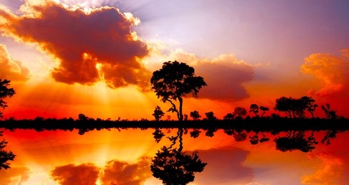 Beautiful African sunset reflected in water in Kruger National Park
