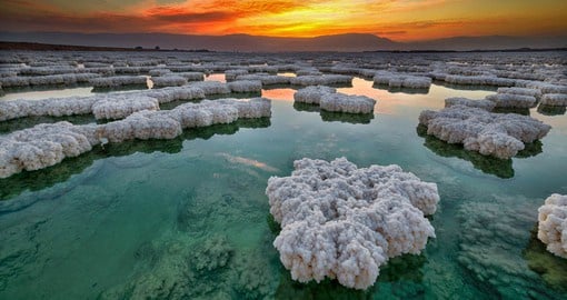 Salt hovers over the Dead Sea coastline during sunset - a truly stunning view