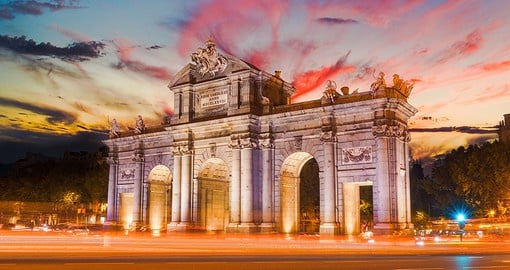 Capture neo-classic beauty when visiting the arching Puerta de Alcala