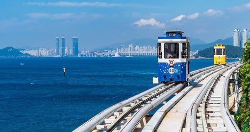 Witness the vibrant blue waters around Busan when taking the Sky Capsule