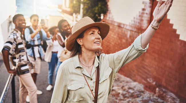 Woman leading a tour group in city