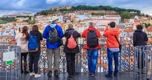 Group of tourist stand at a lookout in Lisbon, Portugal
