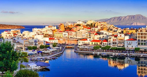 Enjoy a slower pace on the colourful coastal town of Agios Nikolaos,