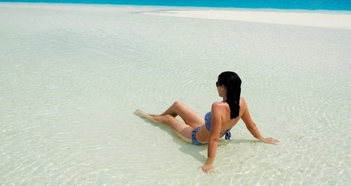 Woman relaxing on Aitutaki Lagoon