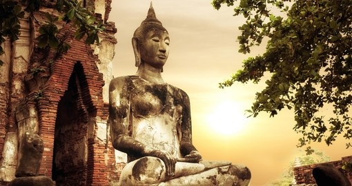 Ancient sandstone sculpture of Buddha at Wat Mahathat ruins