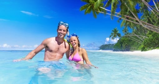 Smiling couple snorkeling