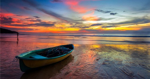 Enjoy a beach sunset on your Thailand vacation