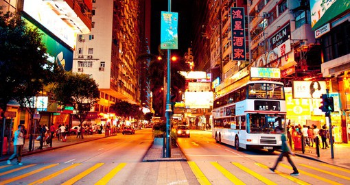 Experience the hustle and bustle of the streets in Hong Kong at night on your Hong Kong Vacation