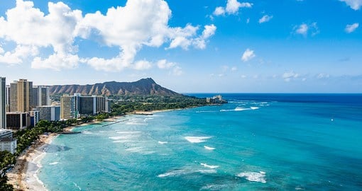 Get a glimpse of the famous Diamond Head Crater while enjoying Waikiki Beach