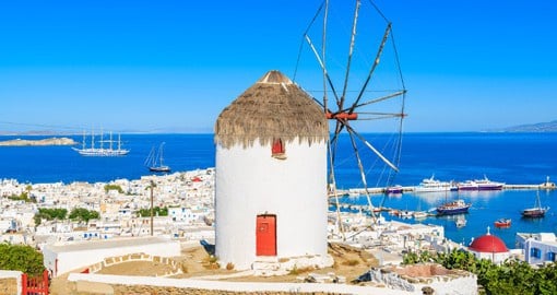 Experience the port side town of Mykonos and enjoy wonderful architecture and local cuisine on your Trips to Greece
