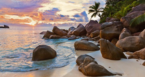 Praslin Island, known for its palm-fringed beaches, boasts a beautiful sunset that must be captured