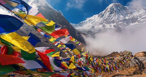 Capture the beauty of prayer flags, meant to spread their blessings with the blowing wind