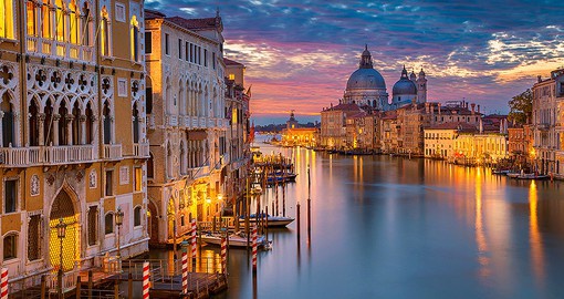 The famous Grand Canal from Rialto Bridge is a must photograph spot while on your Italy vacation.
