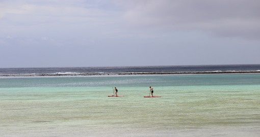 Enjoy Paddle Boarding on the open ocean during your next Cook Island tours.