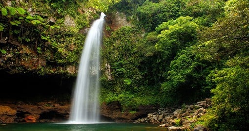 Take a dip in nature's pool at the Tavoro Waterfall, featuring upper, mid, and lower sections