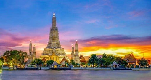 Wat Arun, nicknamed the Temple of Dawn sits on the banks of the Chao Phraya River