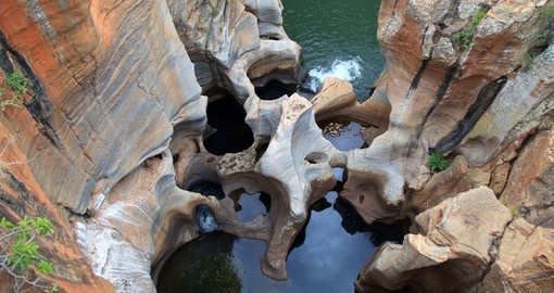 See Rock formations at Bourke's Luck Potholes during your South African vacation.