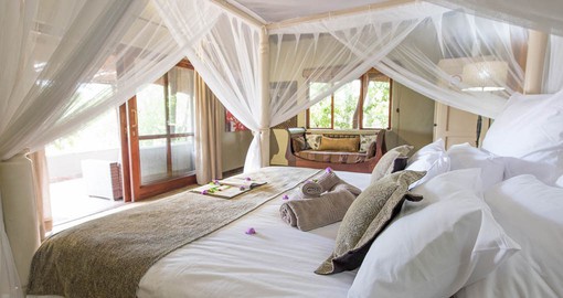 Each chalet is individually decorated and is equipped with an overhead fan, beautiful four poster beds