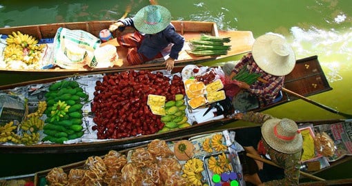 A traditional floating market in Bangkok with a selection of Thai delicacies