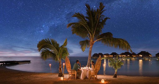 Enjoy a romantic dinner on the beach on your trip to Australia.