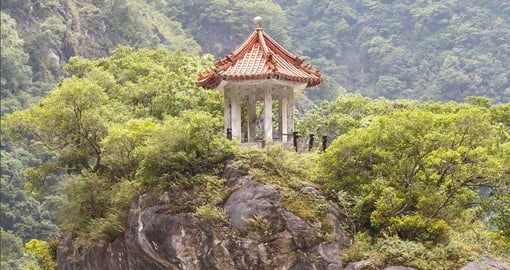 Pavilion perched atop a cliff in the mountains