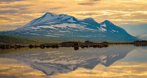 Head up North to the Swedish Laplands to view the peaks of Mount Akka