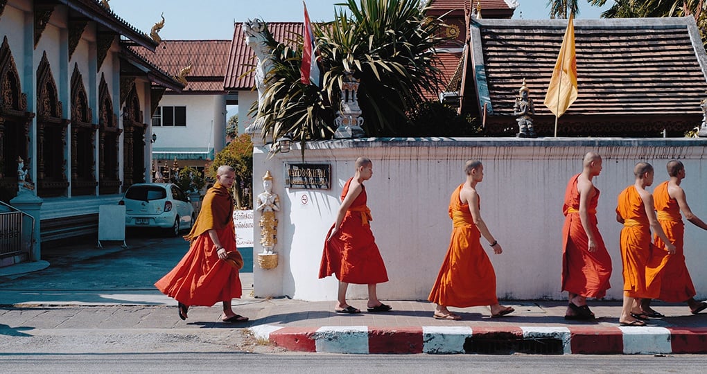 Monks outside a temple in Bangkok, Thailand