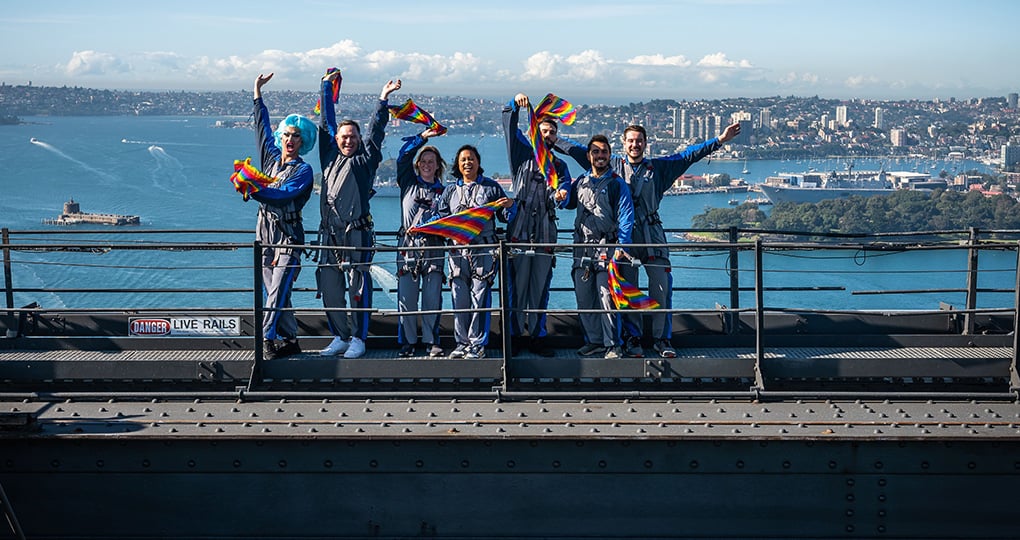 Proud LGBTQ+ Climbers at the top of Sydney Harbour Bridge